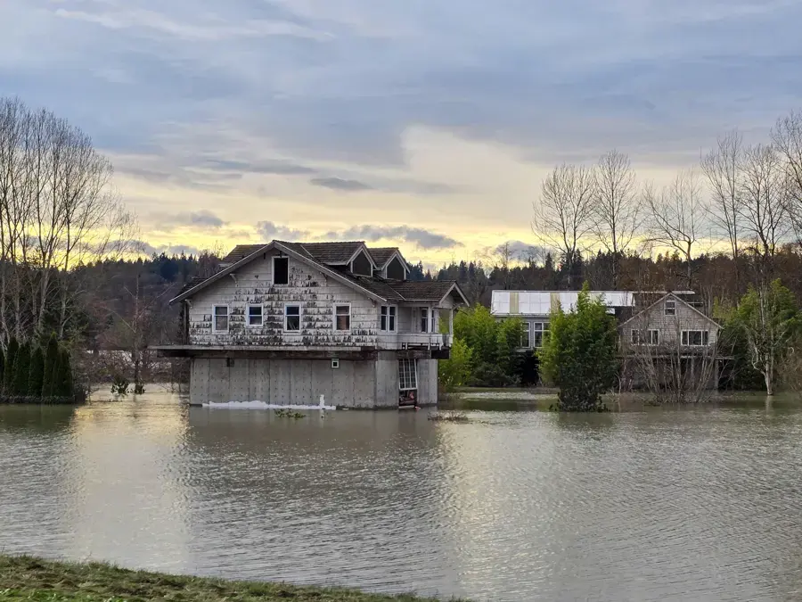 River floodwater surrounding homes in the Snohomish County lowlands