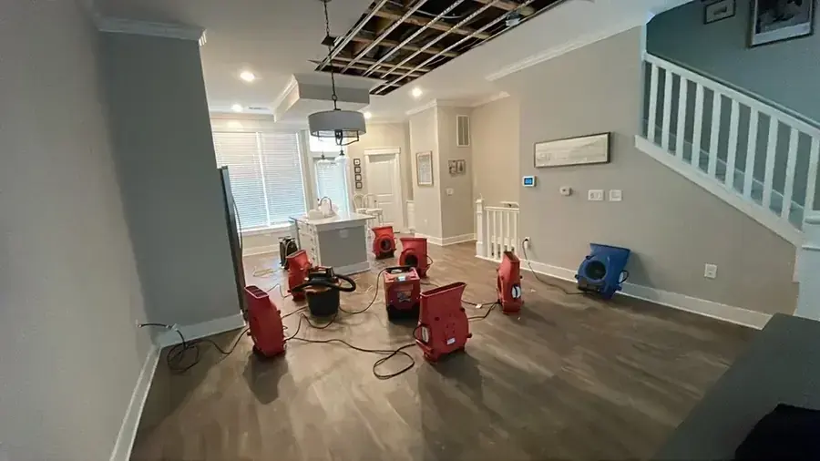 Air movers drying floors and walls through an Everett home